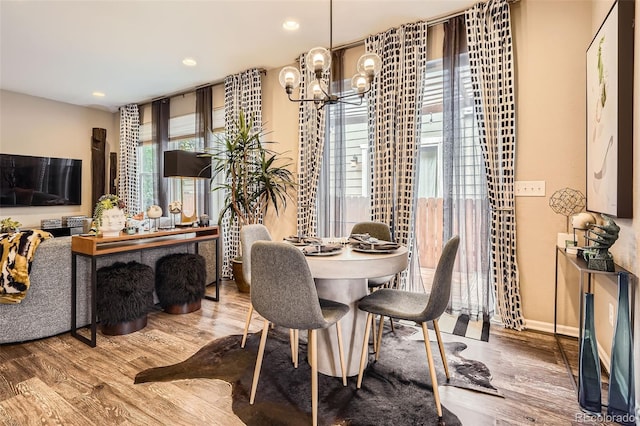 1519 S Dayton St, Denver, CO 80247 - dining room with wood finished floors, a chandelier, and recessed lighting