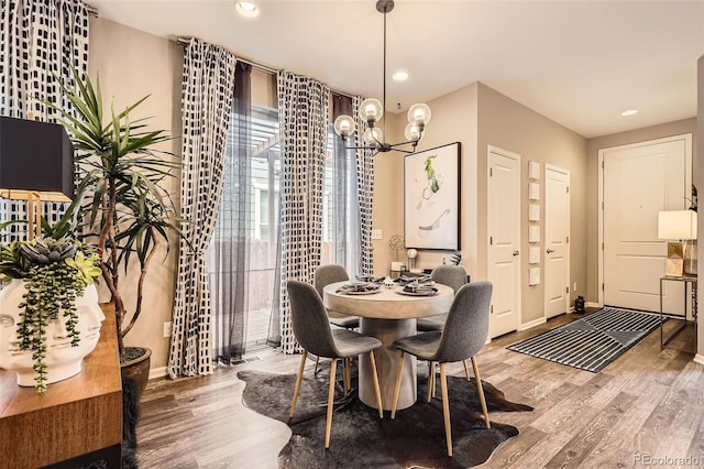 1519 S Dayton St, Denver, CO 80247 - dining room with a chandelier, wood finished floors, and recessed lighting