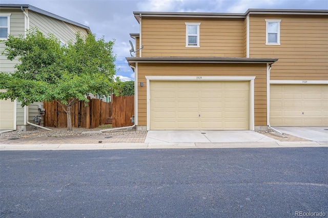 1519 S Dayton St, Denver, CO 80247 - view of front facade with a garage