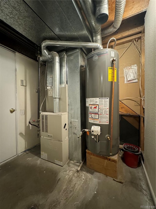 utility room featuring water heater