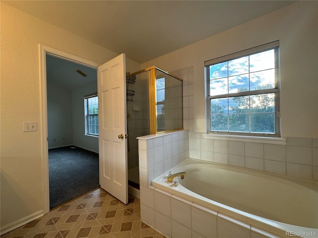 bathroom with independent shower and bath