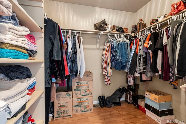spacious closet featuring wood finished floors