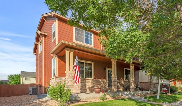 11034 Nome St, Commerce City, CO 80640 - view of front of home featuring a porch and stone siding