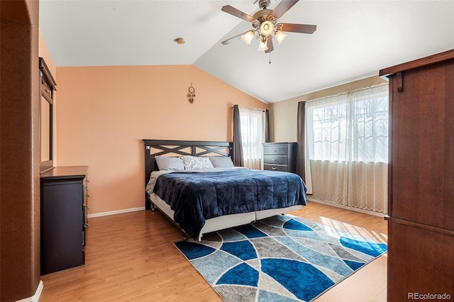 11034 Nome St, Commerce City, CO 80640 - bedroom with light wood finished floors, lofted ceiling, and a ceiling fan