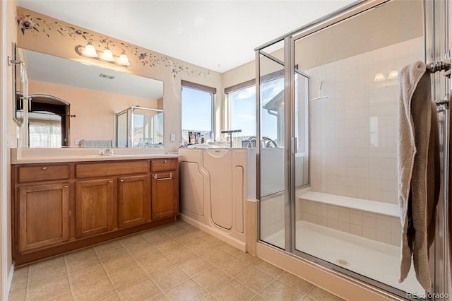 11034 Nome St, Commerce City, CO 80640 - full bathroom featuring a shower stall, vanity, and tile patterned flooring