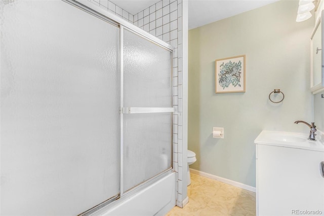 4476 S Lincoln St, Englewood, CO 80113 - bathroom featuring toilet, baseboards, vanity, and shower / bath combination with glass door