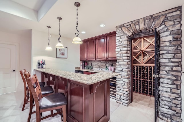 bar with light tile patterned flooring, recessed lighting, tasteful backsplash, wet bar, and decorative light fixtures