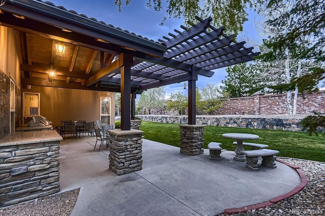 view of patio / terrace featuring a pergola and outdoor dining area