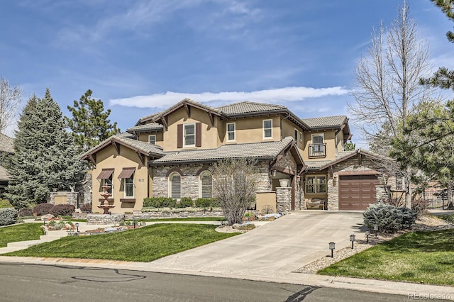 view of front facade featuring stone siding, a garage, stucco siding, a front yard, and driveway