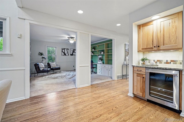 10849 E Crestridge Cir, Englewood, CO 80111 - bar with beverage cooler, light wood finished floors, recessed lighting, tasteful backsplash, and a ceiling fan