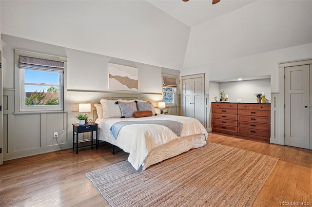 10849 E Crestridge Cir, Englewood, CO 80111 - bedroom with light wood-style flooring, high vaulted ceiling, and a ceiling fan