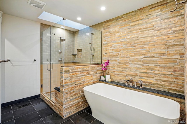 10849 E Crestridge Cir, Englewood, CO 80111 - full bathroom with a shower stall, a freestanding bath, recessed lighting, tile patterned flooring, and tile walls