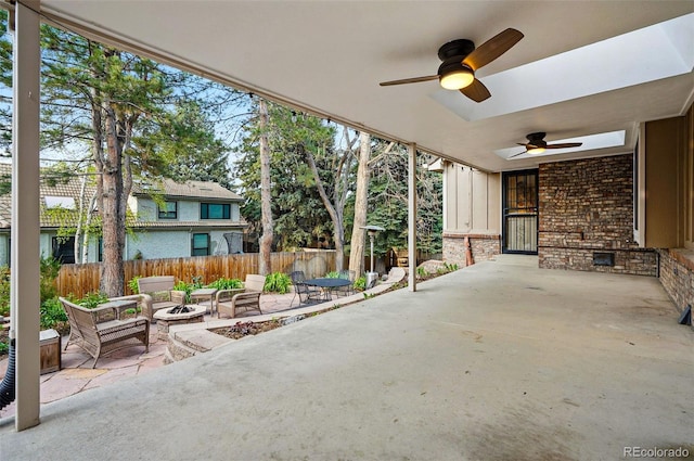 10849 E Crestridge Cir, Englewood, CO 80111 - view of patio / terrace featuring an outdoor fire pit, a ceiling fan, and fence