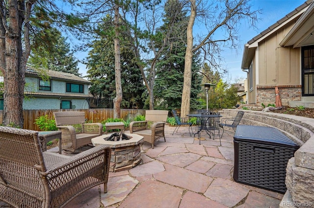 10849 E Crestridge Cir, Englewood, CO 80111 - view of patio featuring a fire pit, fence, and outdoor dining area