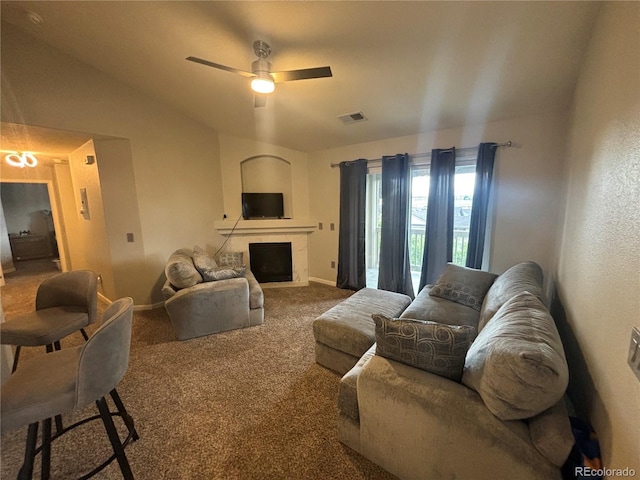 living room with carpet, vaulted ceiling, and ceiling fan