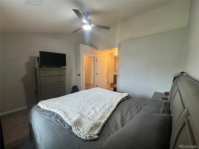 bedroom with carpet flooring, ceiling fan, ensuite bathroom, and vaulted ceiling