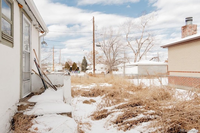 view of yard covered in snow