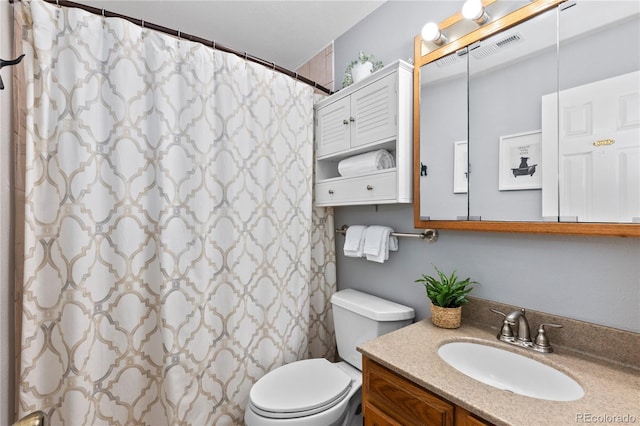 bathroom with vanity, a shower with curtain, and toilet