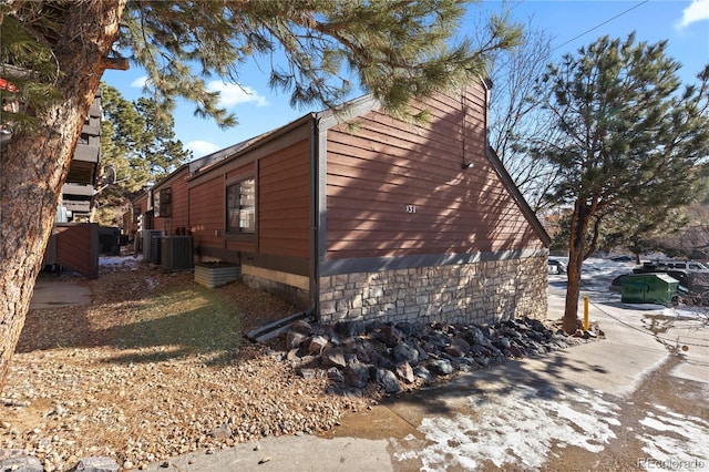 view of home's exterior with central AC unit