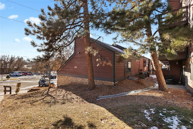 view of property exterior with central AC