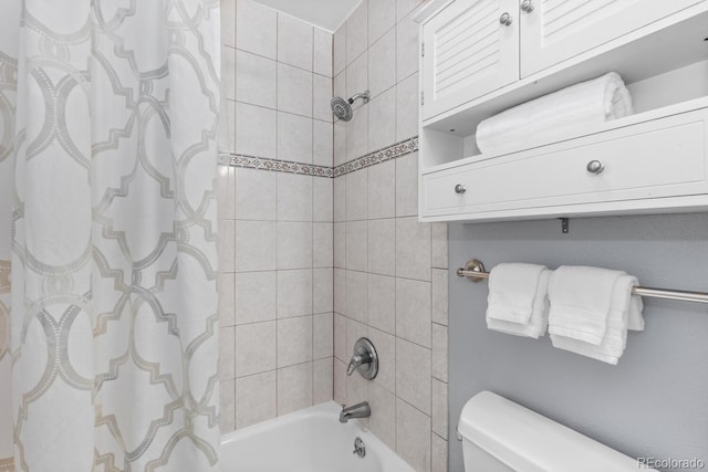 bathroom featuring shower / bathtub combination with curtain and toilet