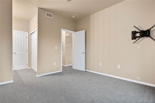 unfurnished bedroom with carpet and baseboards