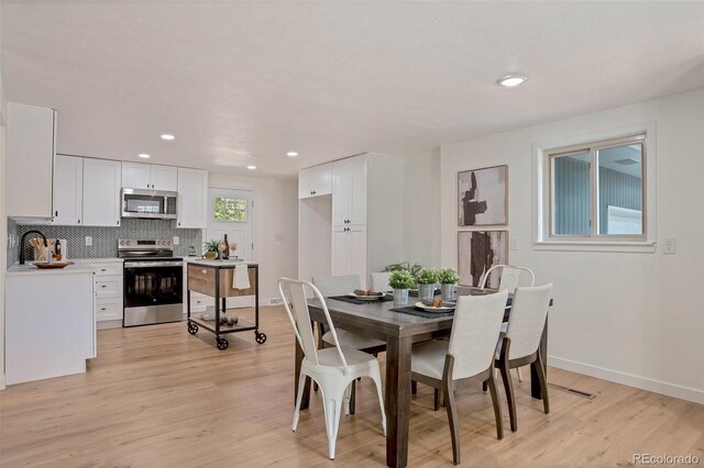 dining area featuring light hardwood / wood-style flooring