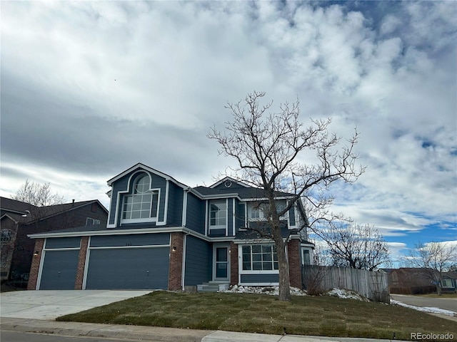 view of front facade featuring a front yard and a garage