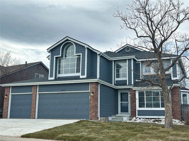 view of property featuring a garage and a front yard