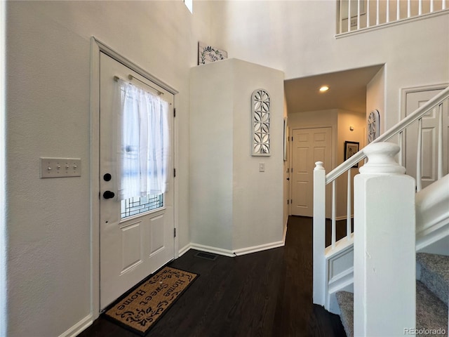 foyer featuring dark wood-type flooring