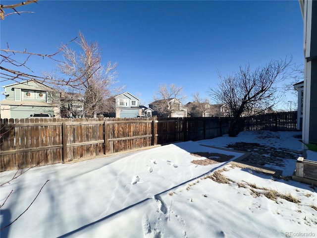 view of yard covered in snow