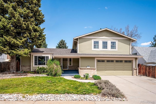 7863 W Quarto Ave, Littleton, CO 80128 - traditional home featuring an attached garage, brick siding, driveway, and covered porch