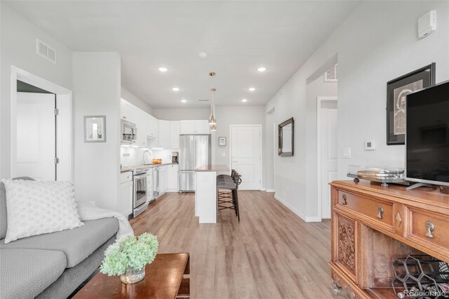 living room featuring light wood-type flooring