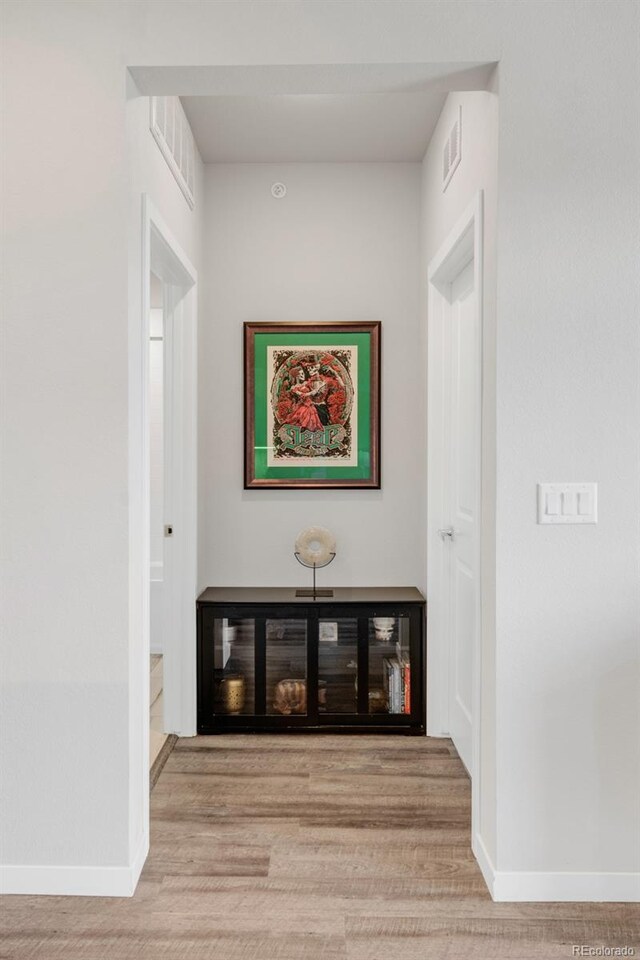 hallway featuring light hardwood / wood-style flooring