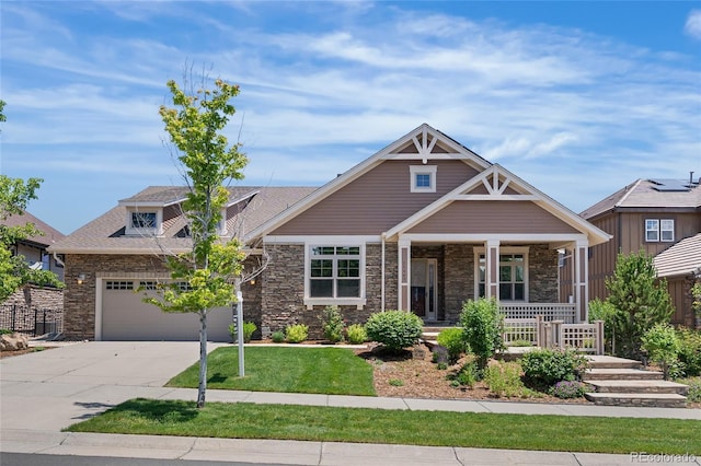 27485 E Nova Pl, Aurora, CO 80016 - craftsman-style home with a porch, stone siding, concrete driveway, and a front lawn