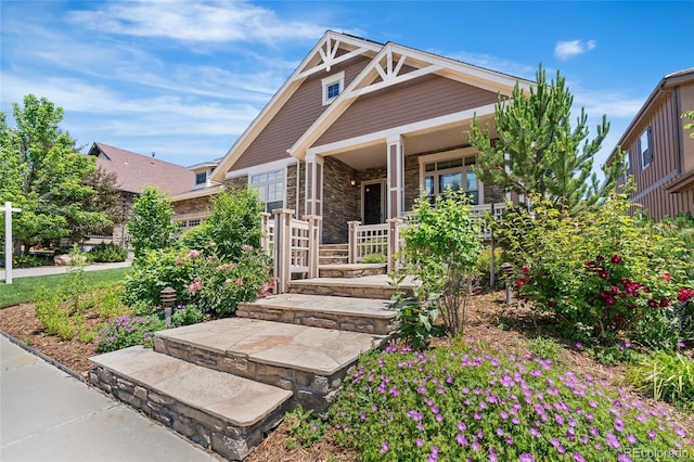 27485 E Nova Pl, Aurora, CO 80016 - craftsman inspired home featuring covered porch and stone siding