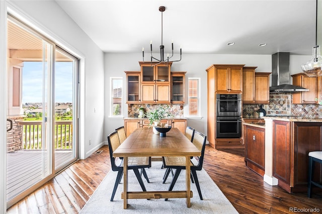 27485 E Nova Pl, Aurora, CO 80016 - dining space with dark wood-style flooring, recessed lighting, and a chandelier