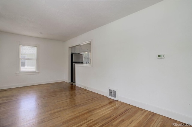 150 S Garfield St, Denver, CO 80209 - empty room with light wood-style floors and baseboards
