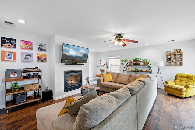 7868 Downing St, Denver, CO 80229 - living area featuring a ceiling fan, a glass covered fireplace, recessed lighting, hardwood / wood-style flooring, and baseboards