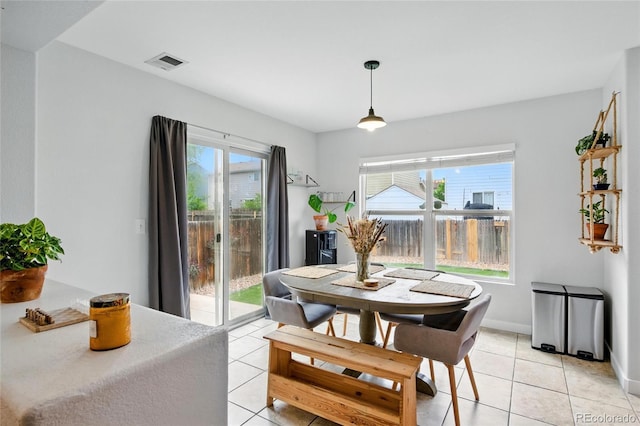7868 Downing St, Denver, CO 80229 - dining room with light tile patterned floors and baseboards