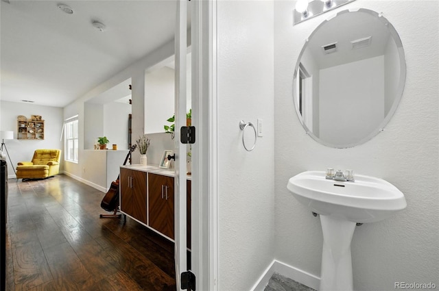 7868 Downing St, Denver, CO 80229 - bathroom with wood finished floors and baseboards