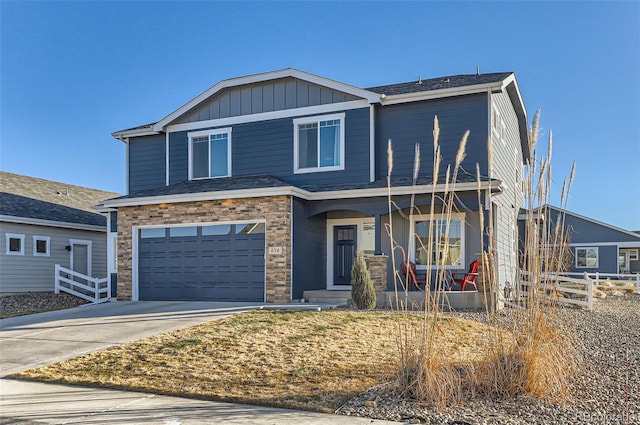 view of front of property with a garage and covered porch