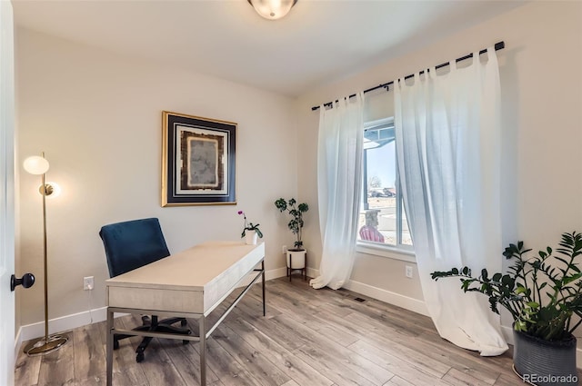 home office featuring hardwood / wood-style flooring