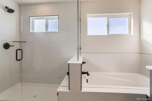 bathroom featuring plus walk in shower