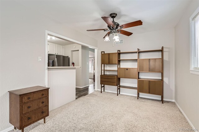 1011 Uvalda St, Aurora, CO 80011 - bedroom featuring freestanding refrigerator, light colored carpet, multiple windows, and ceiling fan
