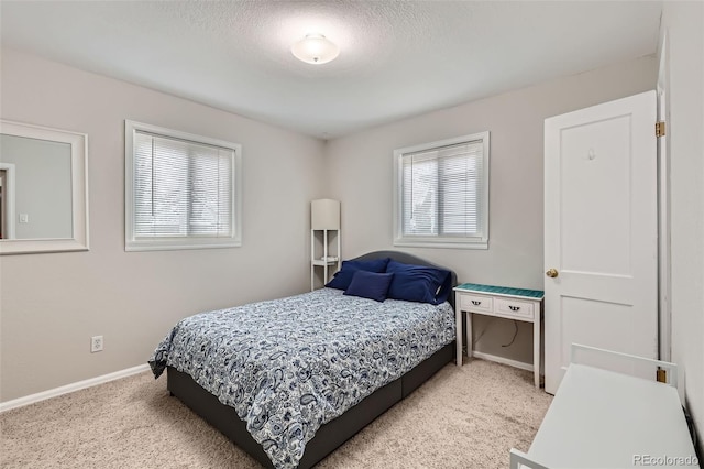 1011 Uvalda St, Aurora, CO 80011 - bedroom with light colored carpet and a textured ceiling