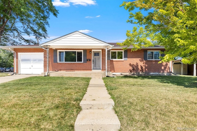 2101 Youngfield St, Golden, CO 80401 - view of front facade featuring an attached garage, brick siding, a front lawn, and concrete driveway