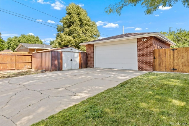 2101 Youngfield St, Golden, CO 80401 - garage with a storage unit and concrete driveway