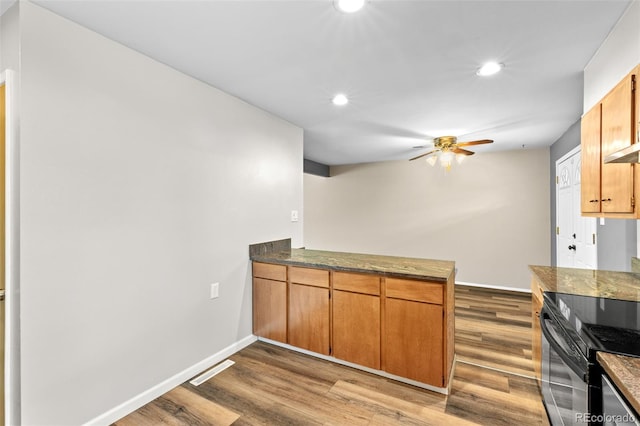 2101 Youngfield St, Golden, CO 80401 - kitchen featuring range with electric cooktop, a ceiling fan, recessed lighting, wood finished floors, and a peninsula
