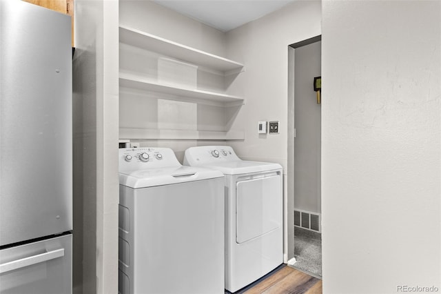 2101 Youngfield St, Golden, CO 80401 - washroom featuring independent washer and dryer and wood finished floors